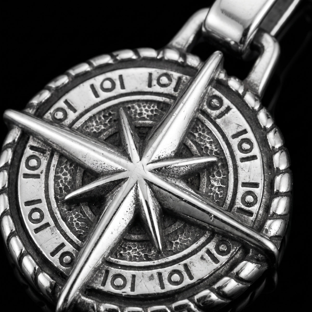 Macro close-up of the Compass Of Life pendant in 316L stainless steel, Outlaws Amsterdam