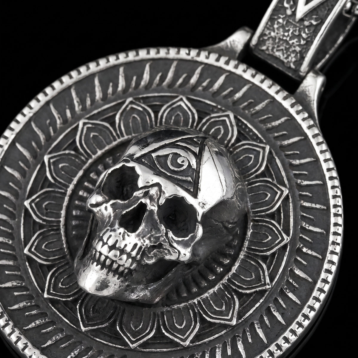 Macro close-up of the In The Eyes Of Death pendant in 316L stainless steel, Outlaws Amsterdam