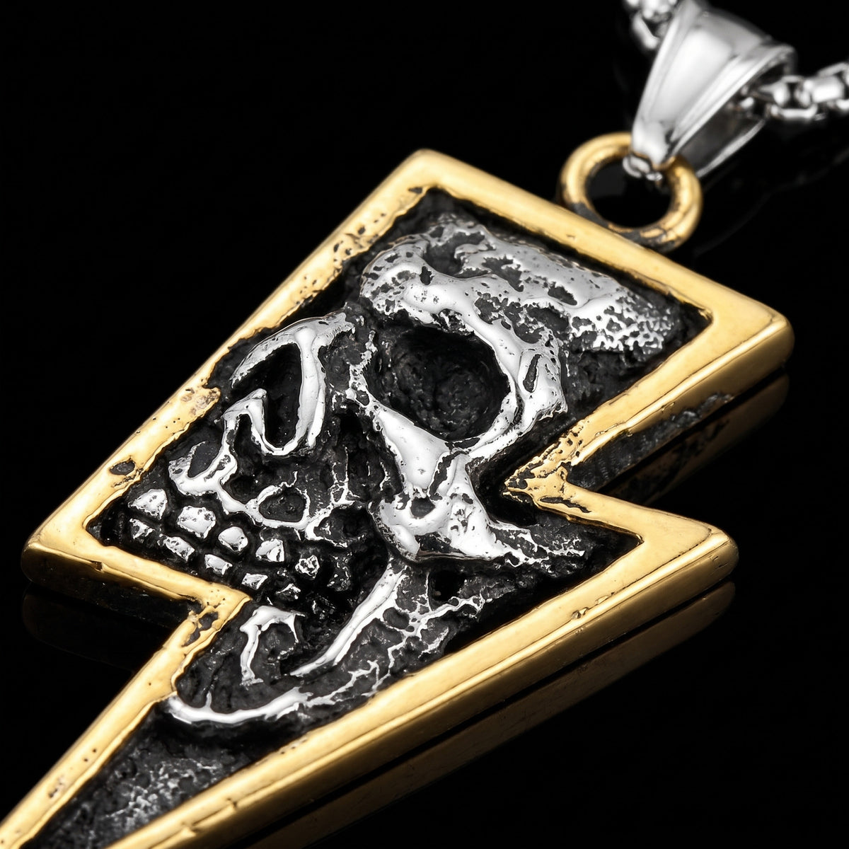 Macro close-up of the Lightning Gold pendant in 316L stainless steel, Outlaws Amsterdam