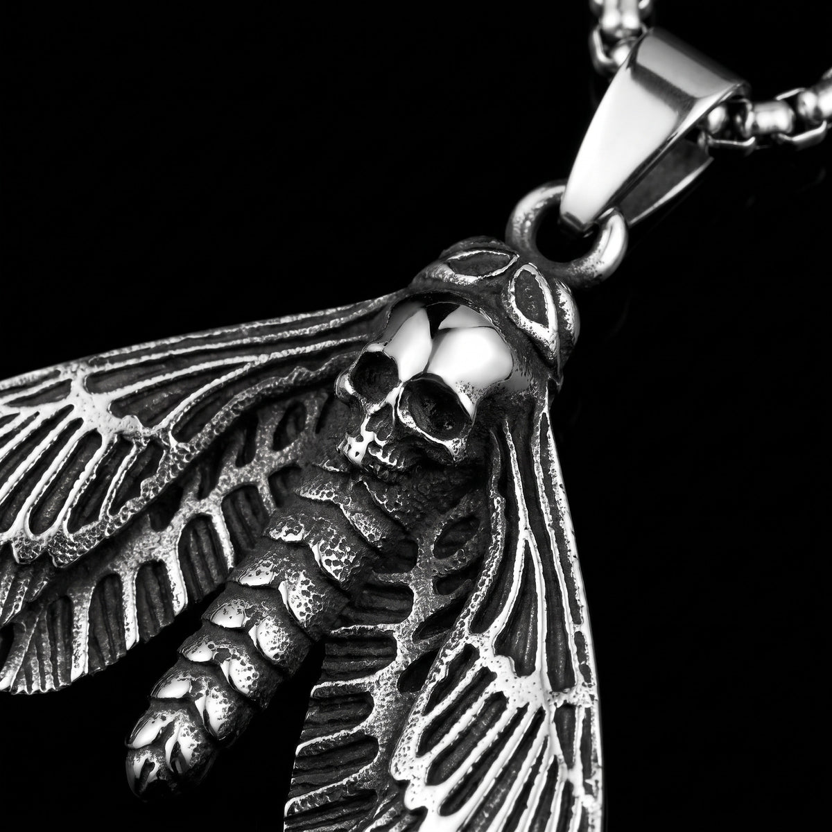 Macro close-up of the Skull Butterfly pendant in 316L stainless steel, Outlaws Amsterdam