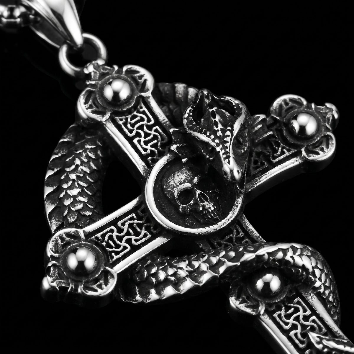 Macro close-up of the Snake Cross pendant in 316L stainless steel, Outlaws Amsterdam