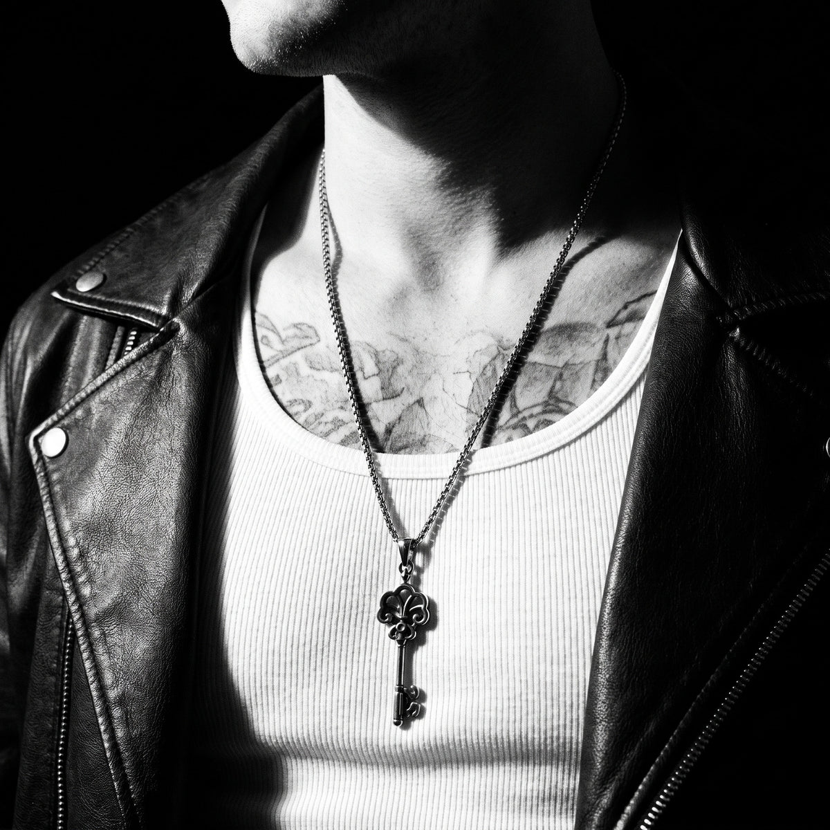Man wearing the The Key To Life pendant on a chain, worn on the chest, 316L stainless steel, Outlaws Amsterdam