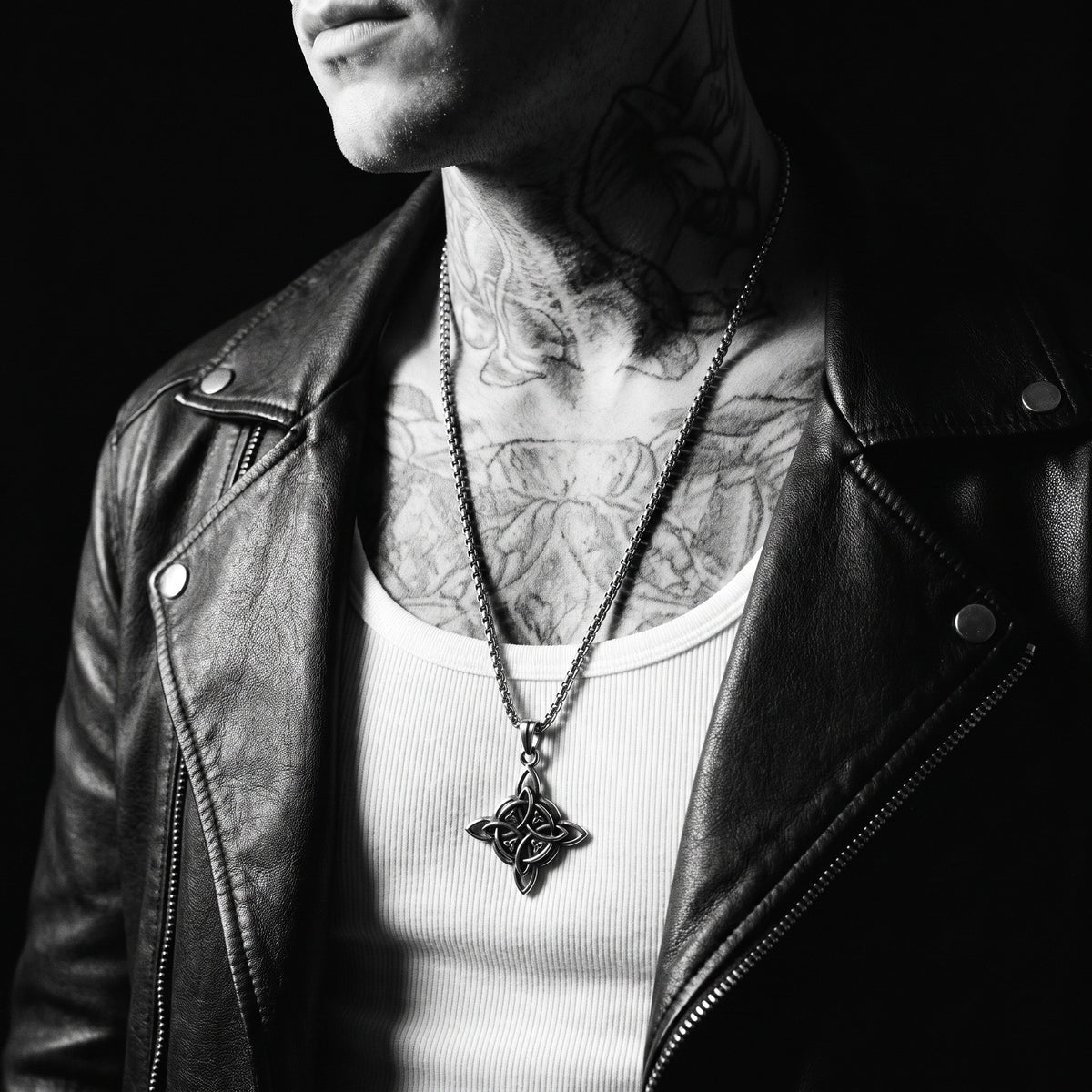 Man wearing the Valknut Cross pendant on a chain, worn on the chest, 316L stainless steel, Outlaws Amsterdam