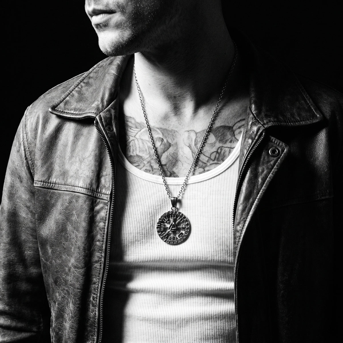 Man wearing the Viking Compass pendant on a chain, worn on the chest, 316L stainless steel, Outlaws Amsterdam