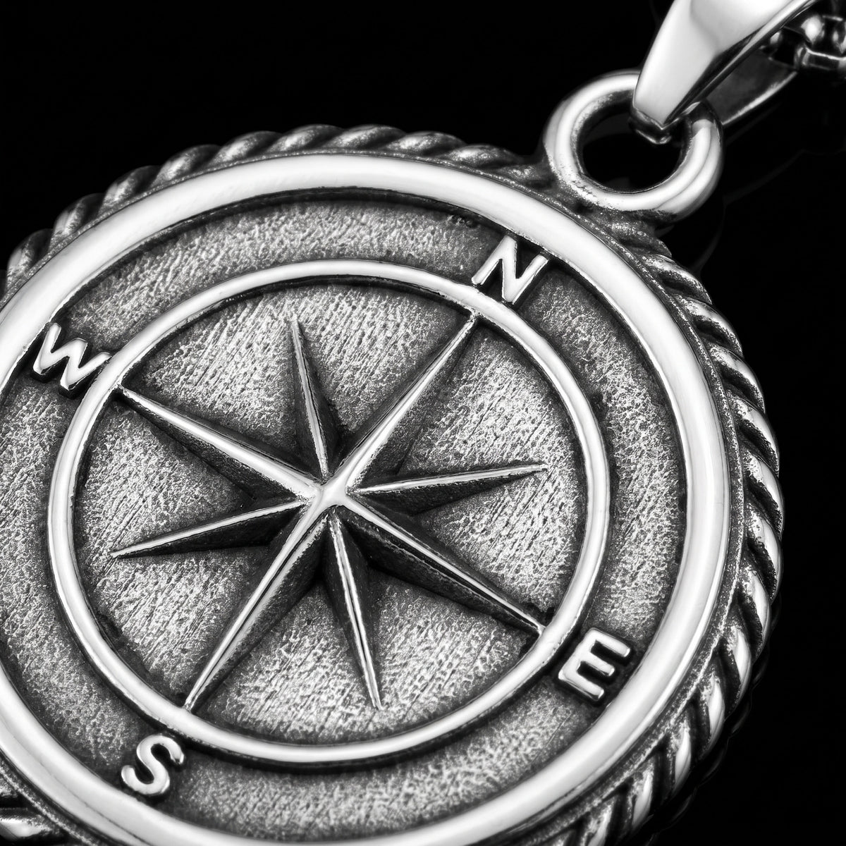 Macro close-up of the Compass pendant in 316L stainless steel, Outlaws Amsterdam