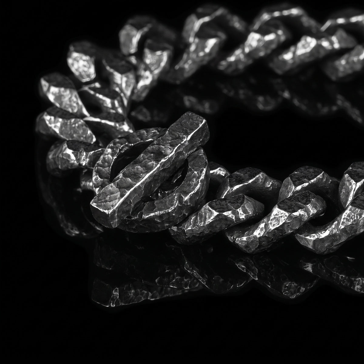 Macro close-up of the Forged Bind bracelet in 316L stainless steel, Outlaws Amsterdam