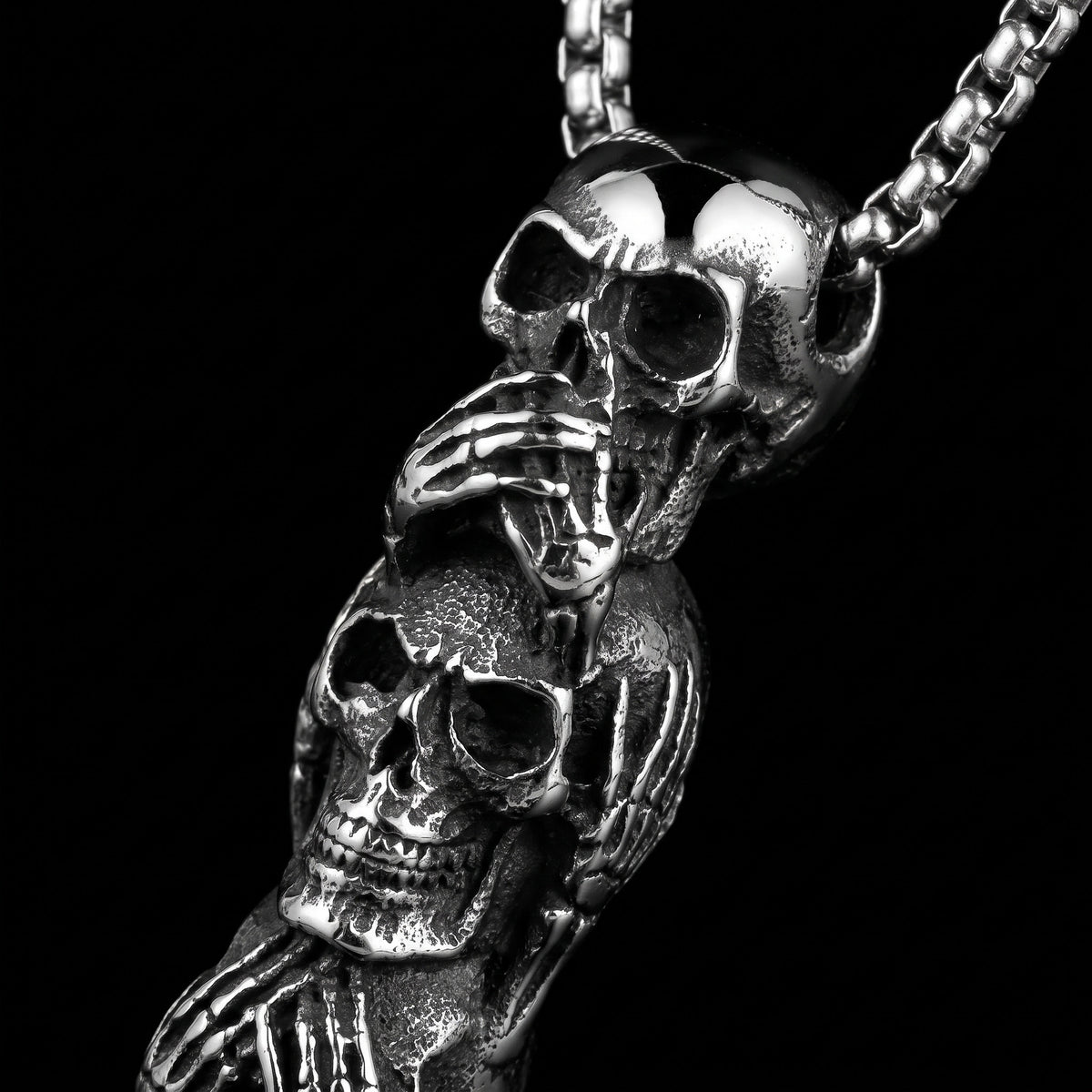 Macro close-up of the Hear See Speak pendant in 316L stainless steel, Outlaws Amsterdam