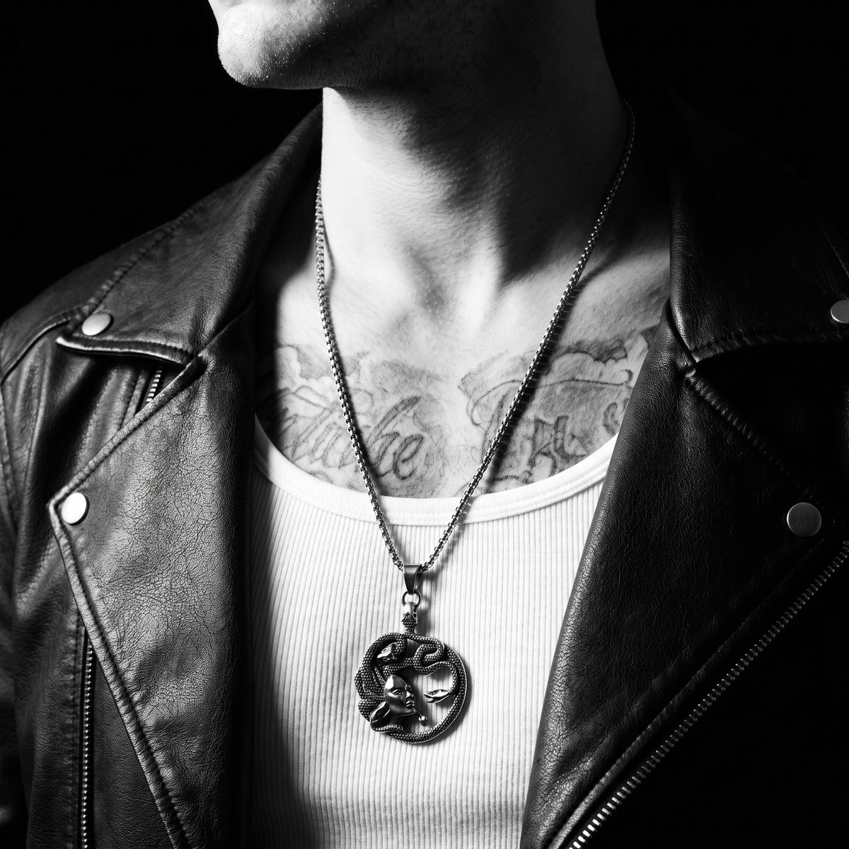 Man wearing the Medusa pendant on a chain, worn on the chest, 316L stainless steel, Outlaws Amsterdam