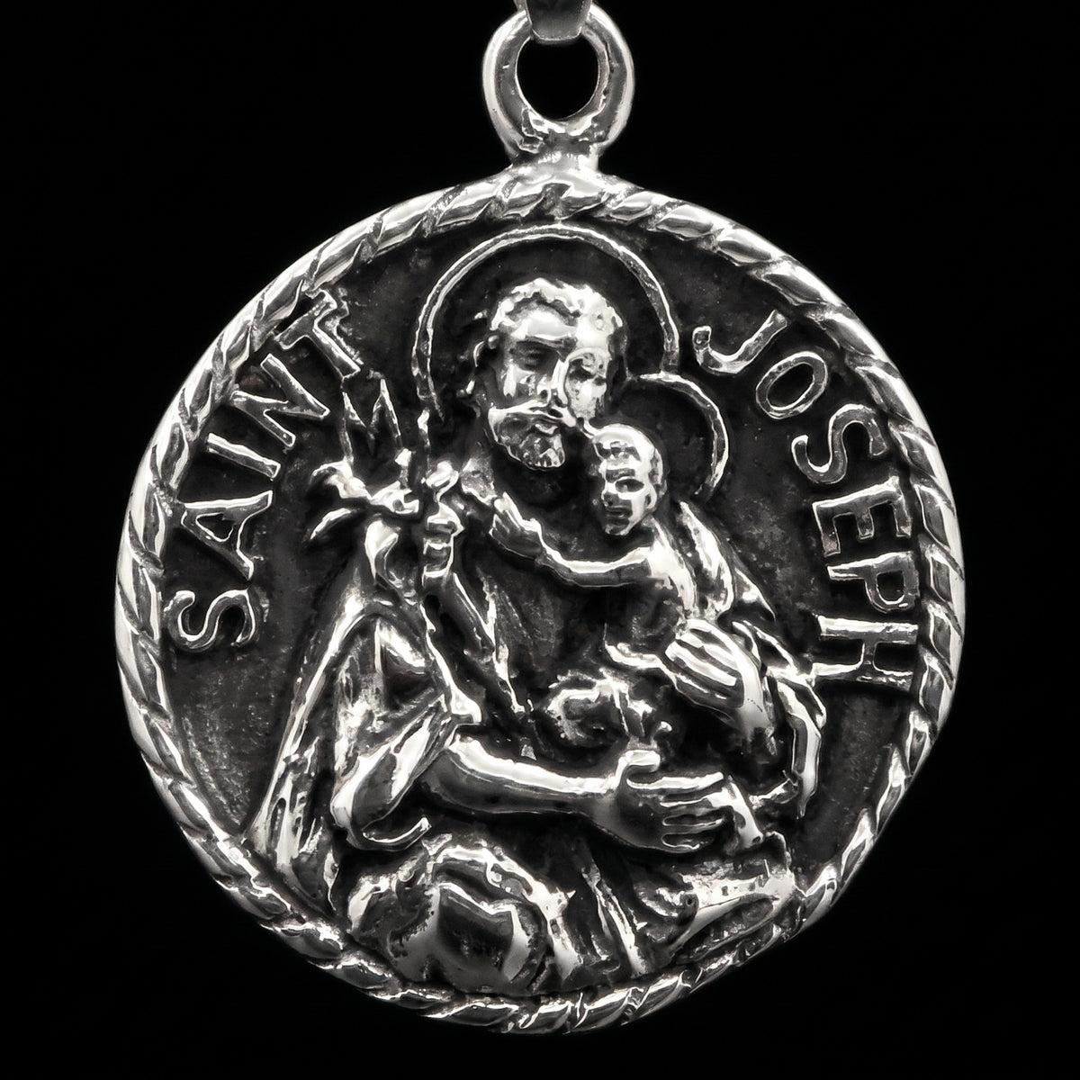 Macro close-up of the St. Joseph pendant in 316L stainless steel, Outlaws Amsterdam
