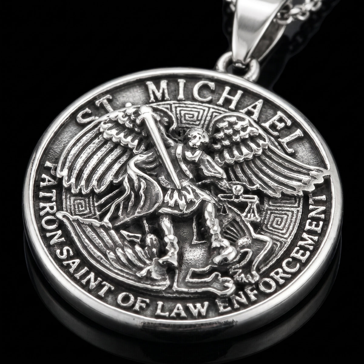 Macro close-up of the St. Michaels pendant in 316L stainless steel, Outlaws Amsterdam